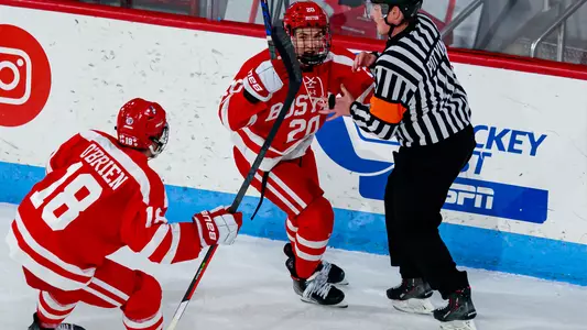 Lane Hutson celebrates his OT goal at Northeastern