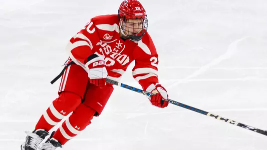Lane Hutson playing hockey