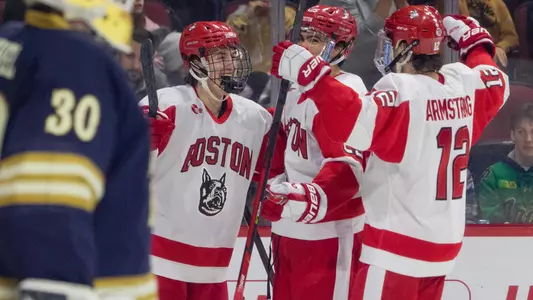 Ty Gallagher, Sam Stevens and Jamie Armstrong celebrate a goal against Notre Dame