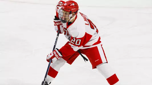 Lane Hutson playing hockey