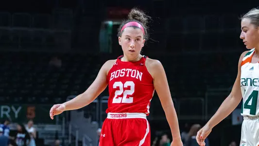 Photo of women's basketball senior Maggie Pina observing a play against Miami