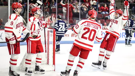 The men's ice hockey team celebrates a goal in the Terriers' win over UNH