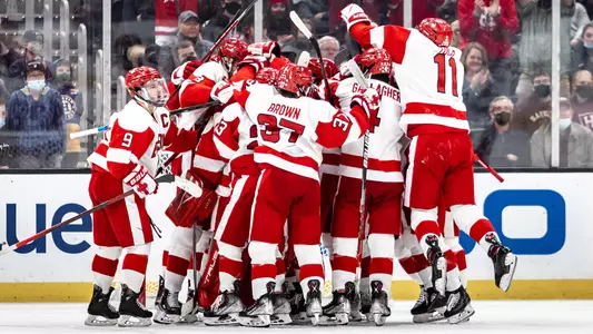 The men's ice hockey team celebrates their win over Harvard in the 69th Beanpot