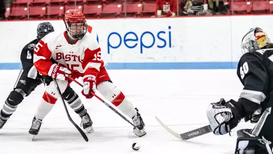 Ellie Larson skates in before scoring on Providence goaltender