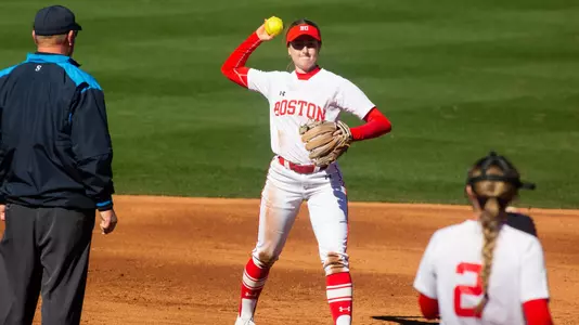 Kate Pryor throws the ball to the pitcher in the circle.