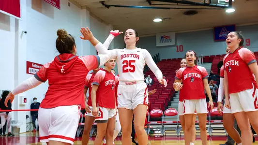 Riley Childs high-fives Alex Giannaros during lineup introductions.