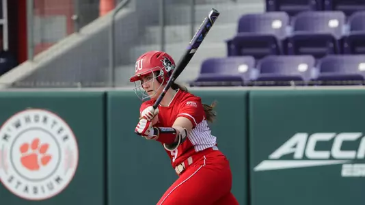 Nicole Amodio connects on a pitch at home plate swinging right handed.