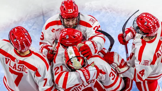 The Terriers celebrate with Vinny Duplessis in his crease