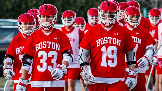 Timmy Ley and Matt Hilburn lead the Terriers onto the field