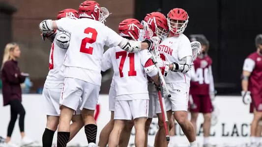 The men's lacrosse team celebrates a goal