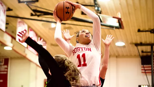 Caitlin Weimar goes up for a layup while an Army defender attempts the block.