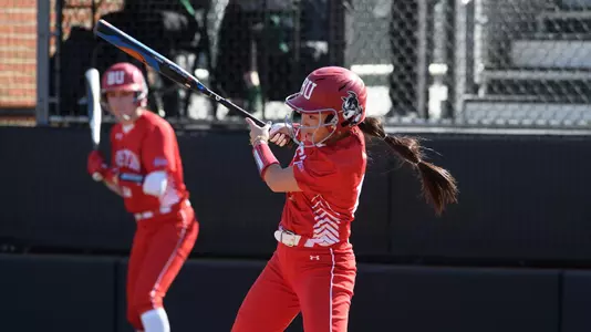 Jen Horita makes contact with a pitch batting left handed