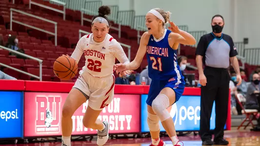 Maggie Pina dribbles past an American defender.