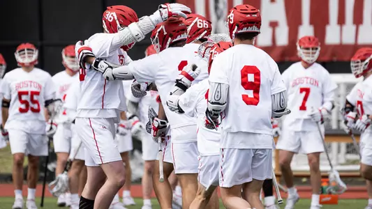 The men's lacrosse team celebrates a goal