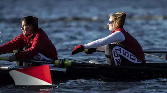 Close up photo of Women's Rowing boat rowing down the Charles River in a practice session.