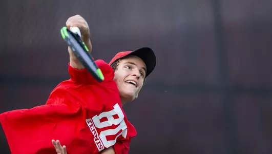 Zak Schneider follows through on a serve