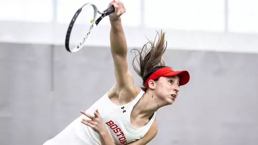 Erica Di Battista nears the completion of an overhead serve