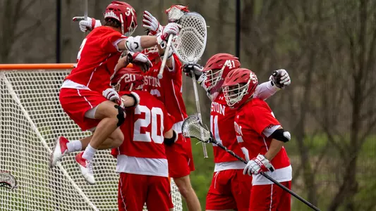 The men's lacrosse team celebrates a win
