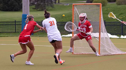 Reilly Agres prepares to make a save against a Bucknell attacker.