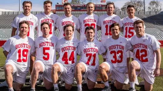 The men's lacrosse Class of 2022 poses for a photo on Nickerson Field