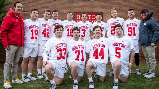 The Boston University men's lacrosse seniors pose for a picture with head coach Ryan Polley