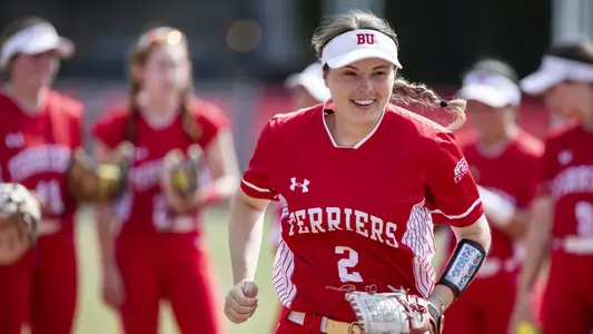 Emily Gant runs through a tunnel during lineup introductions.