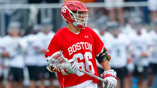 James Corcoran playing lacrosse