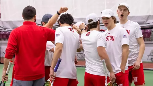 men's tennis team huddle after practice