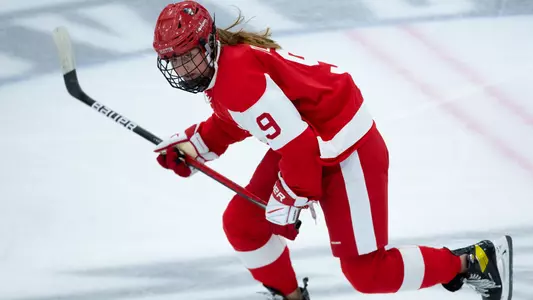 Clare O'Leary playing hockey