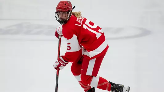 Ellie Larson playing hockey