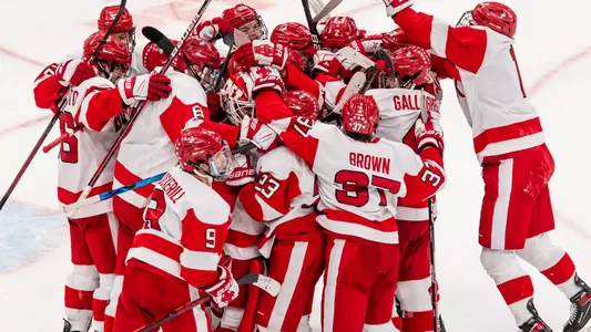 The men's ice hockey team celebrates their win over Harvard in the 69th Beanpot