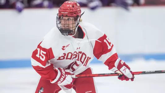 Ellie Larson playing hockey
