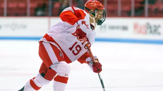 Emma Wuthrich shooting the puck