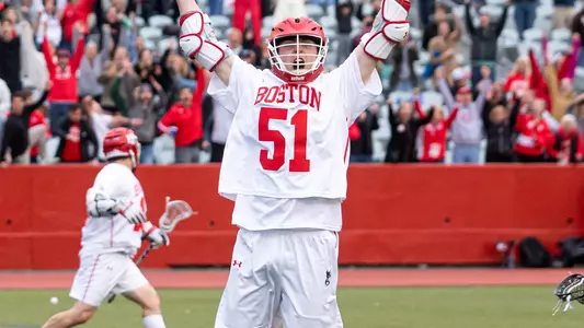 Tommy Bourque raises his arms in celebration after his game-winning goal in the Patriot League semifinals