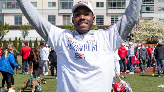 Stephen Gaskil III raises his arms in celebration