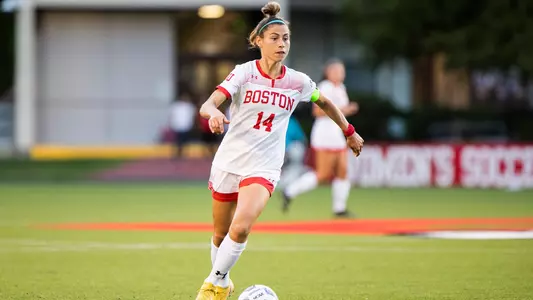 Amy Thompson dribbles the ball against Northeastern.