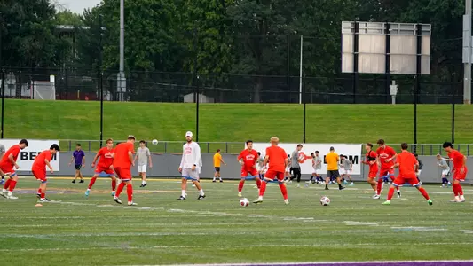 Men's Soccer team is on the field for a pregame warm up drill.