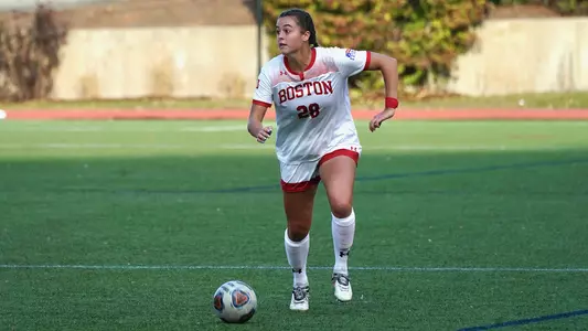 Kayla Ross dribbles with the ball at Nickerson Field.