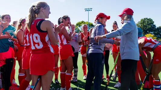 The field hockey team celebrates head coach Sally Starr's 500th career victory.