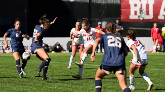 Photo of women's soccer redshirt senior Amy Thompson shooting the game-winning goal against Navy.