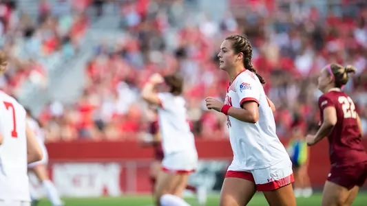 Photo of women's soccer senior Kayla Ross surveying the field.
