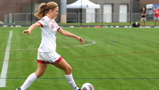 Photo of women's soccer sophomore Erin Sullenberger dribbling the ball.