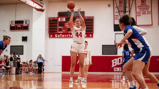 Photo of women's basketball freshman Sam Crispe shooting a free throw against American.
