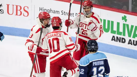Sam Stevens, Tristan Amonte and Nick Zabaneh celebrate a goal against Maine
