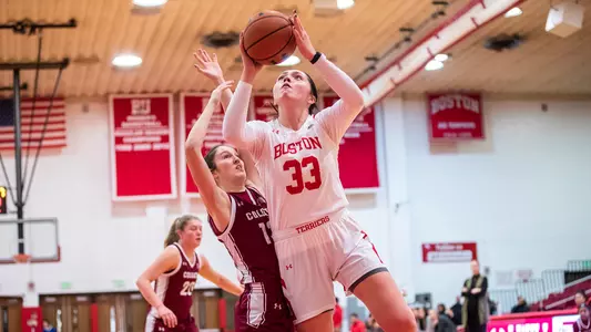 Photo of women's basketball senior Maren Durant going for a layup against Colgate.