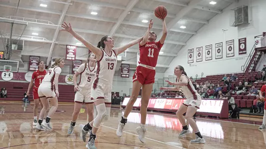 Photo of women's basketball junior Caitlin Weimar going for a layup at Colgate.