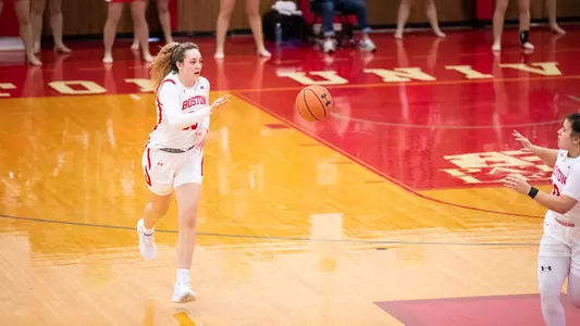 Photo of women's basketball sophomore Lauren Davenport running up the court.