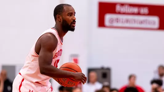 Jonas Harper holds the ball looking to pass the ball.