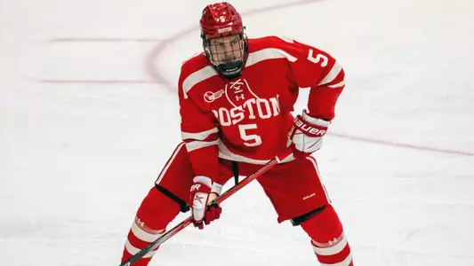 Tom Willander playing hockey for BU