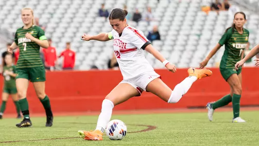 Photo of women's soccer senior Abigail McNulty shooting the ball.